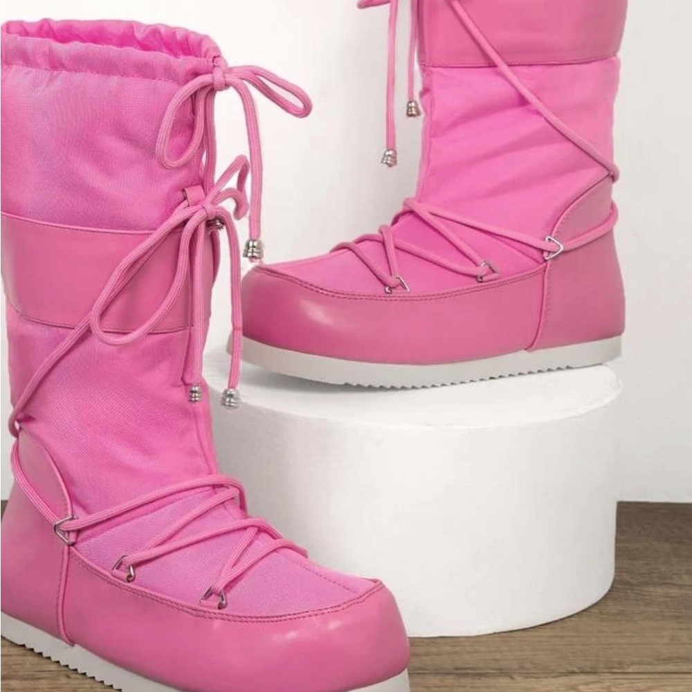 Pink lace up puffy boots